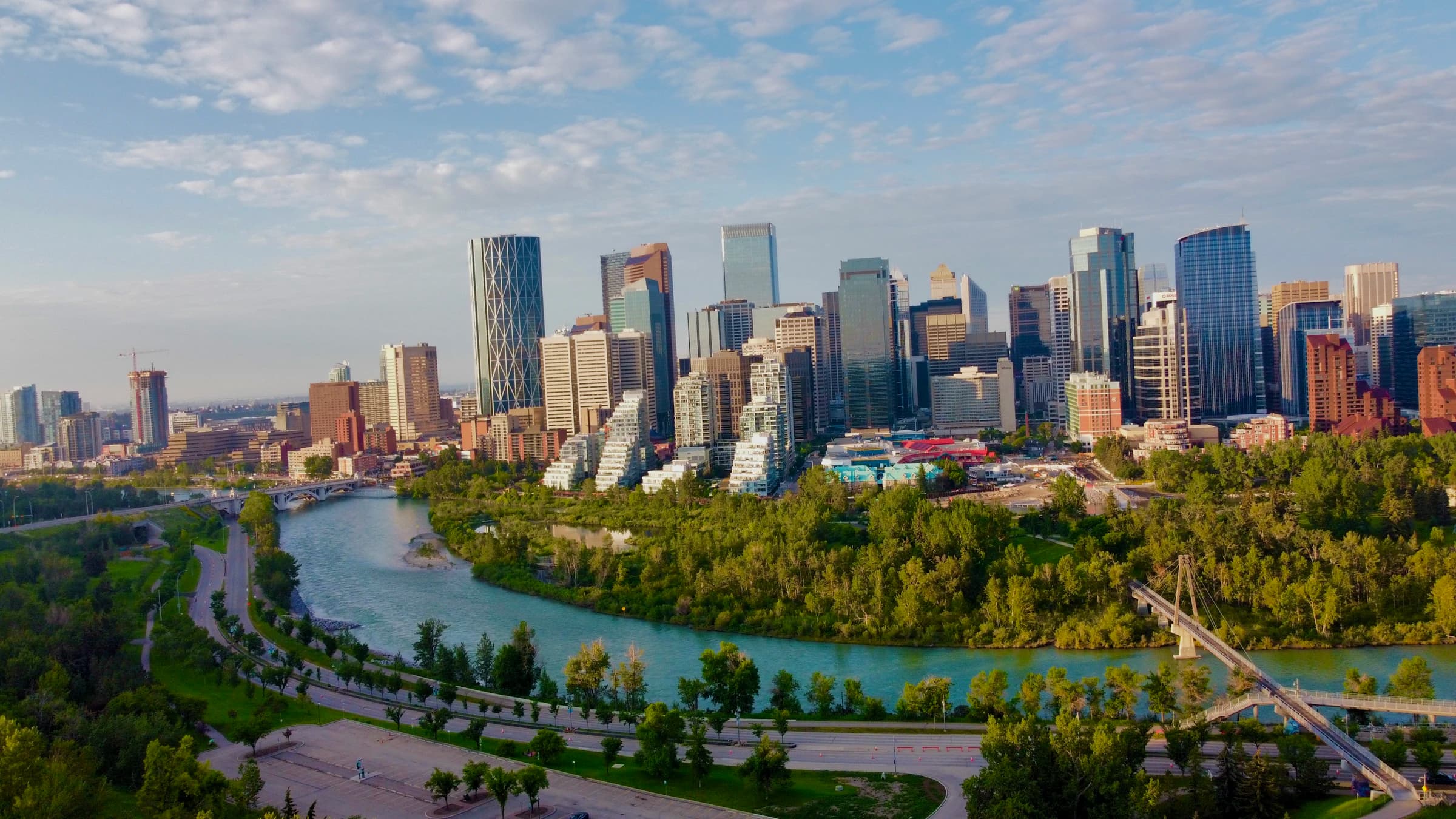 Downtown Calgary skyline above the Bow River and the Peace Bridge